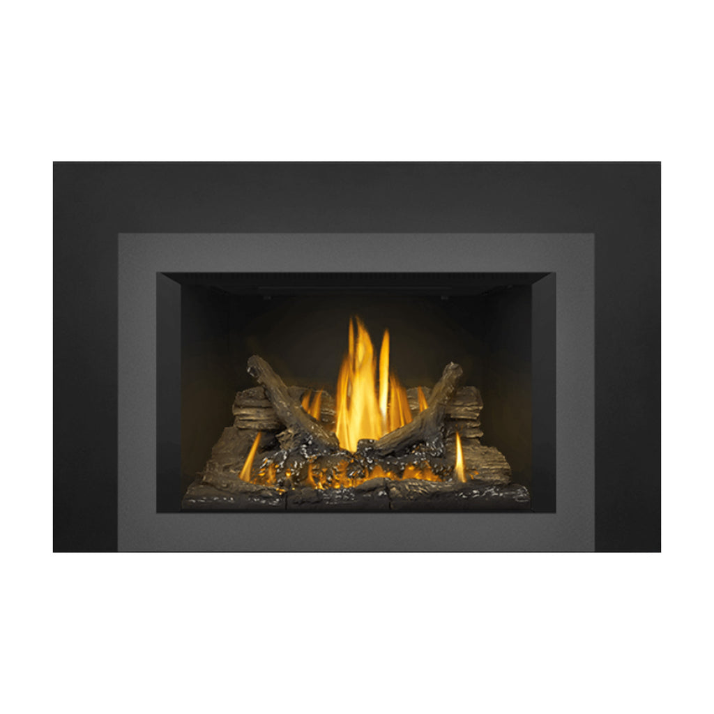 Direct vent gas fireplace insert showing bright yellow flames over dark logs