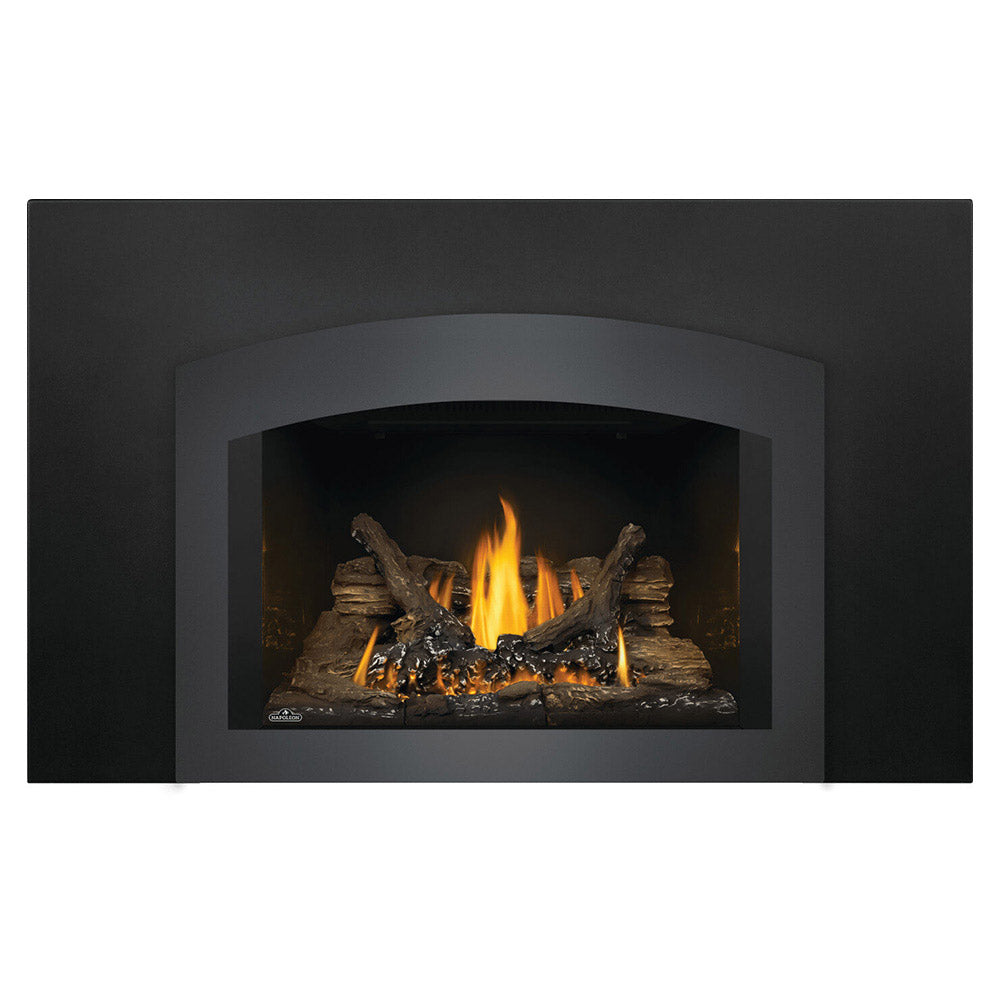 Napoleon direct vent gas fireplace insert with black surround and arched opening, flames on logs