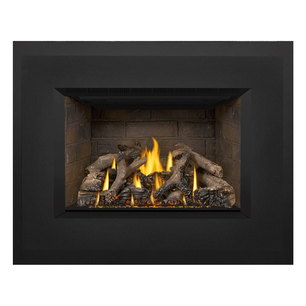 Gas fireplace insert showing stone firebox with burning logs and dark outer frame.