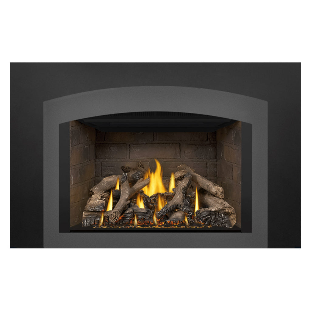 Direct vent gas fireplace insert with black surround and lit burner grate above log bed