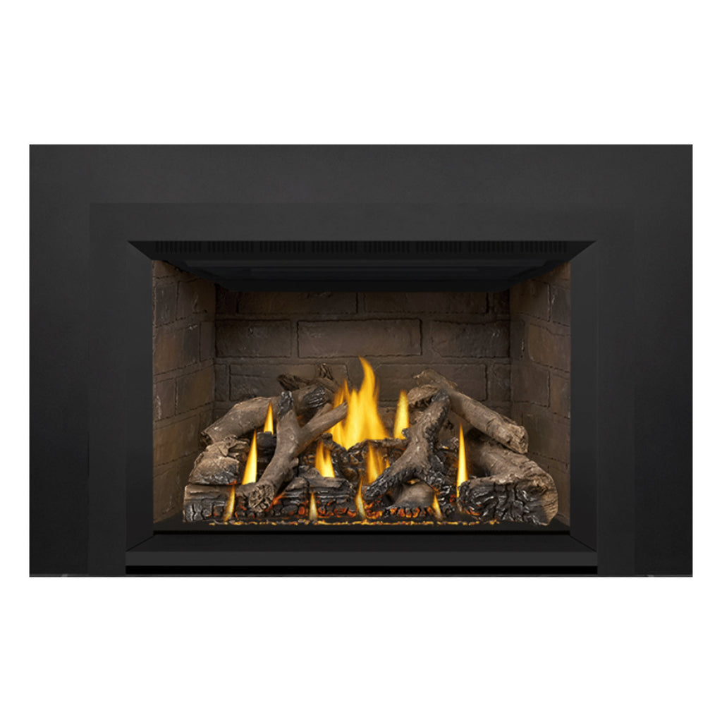 Direct vent gas fireplace insert close view of stone firebox and flames in log and ember bed