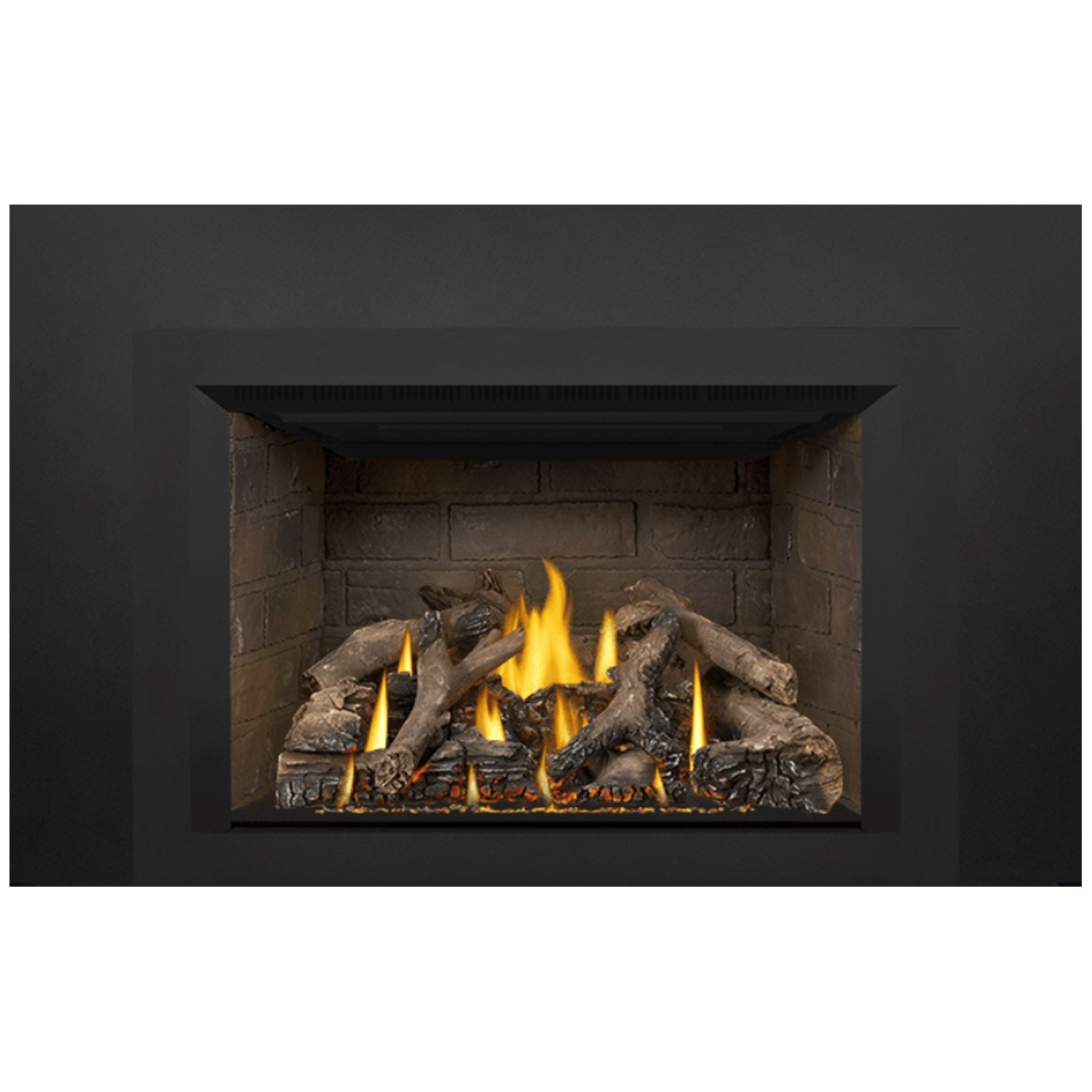 Gas fireplace insert showing burning flames and dark log pieces inside the rectangular firebox