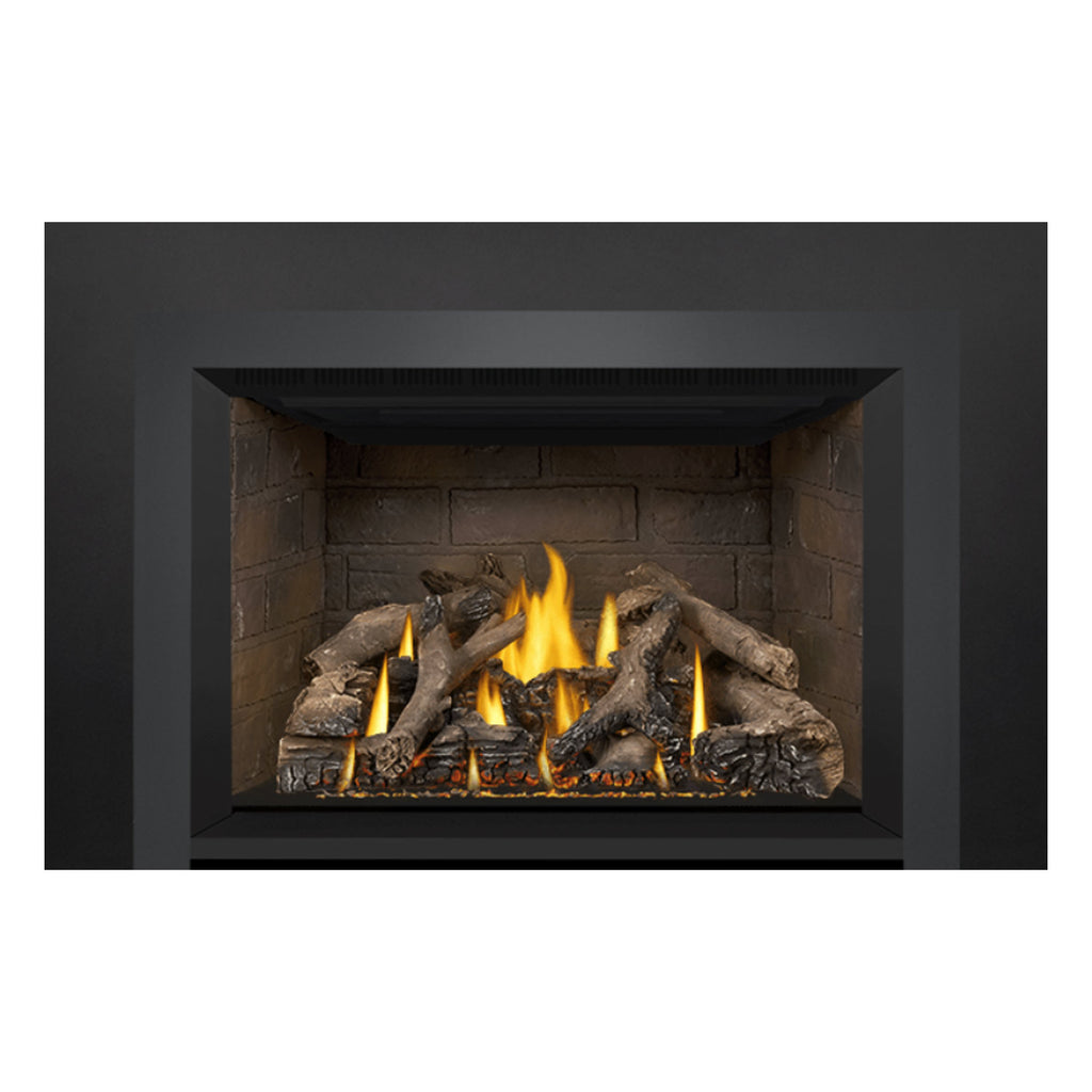 Gas fireplace insert with illuminated flames and decorative logs in the center firebox