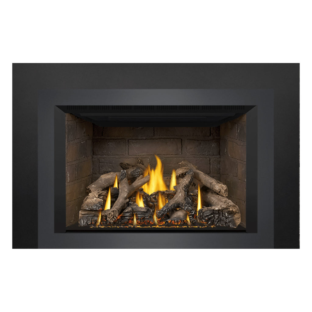 Direct vent gas fireplace insert with dark surround, stone firebox, and visible flame bed.