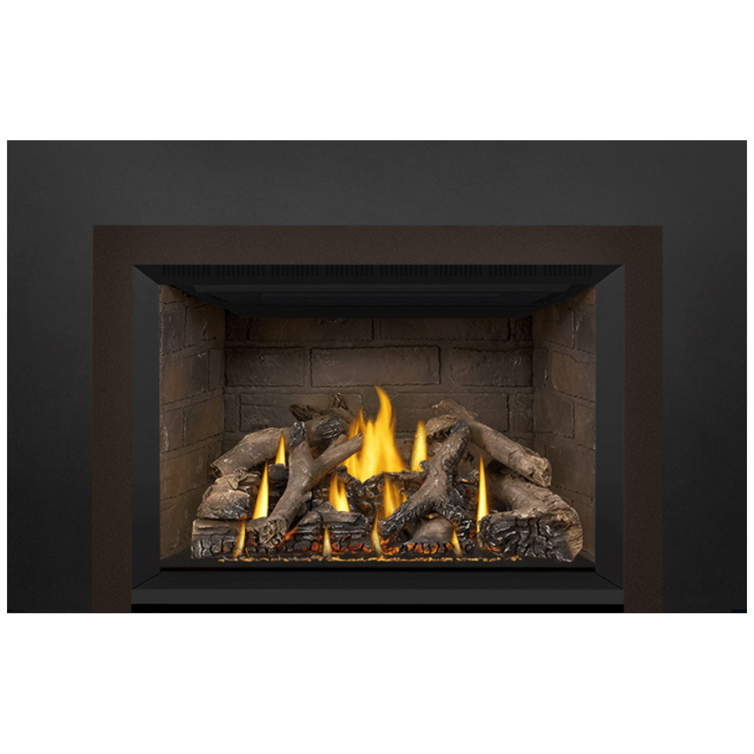 Gas fireplace insert showing glowing flames among dark decorative logs in the firebox