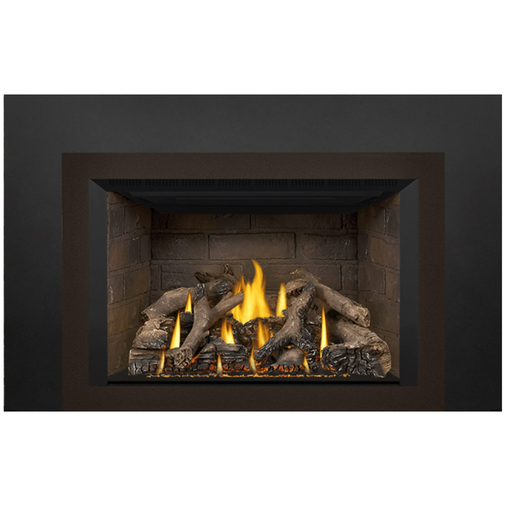 Direct vent gas fireplace insert front opening showing stone firebox, flames, and logs.