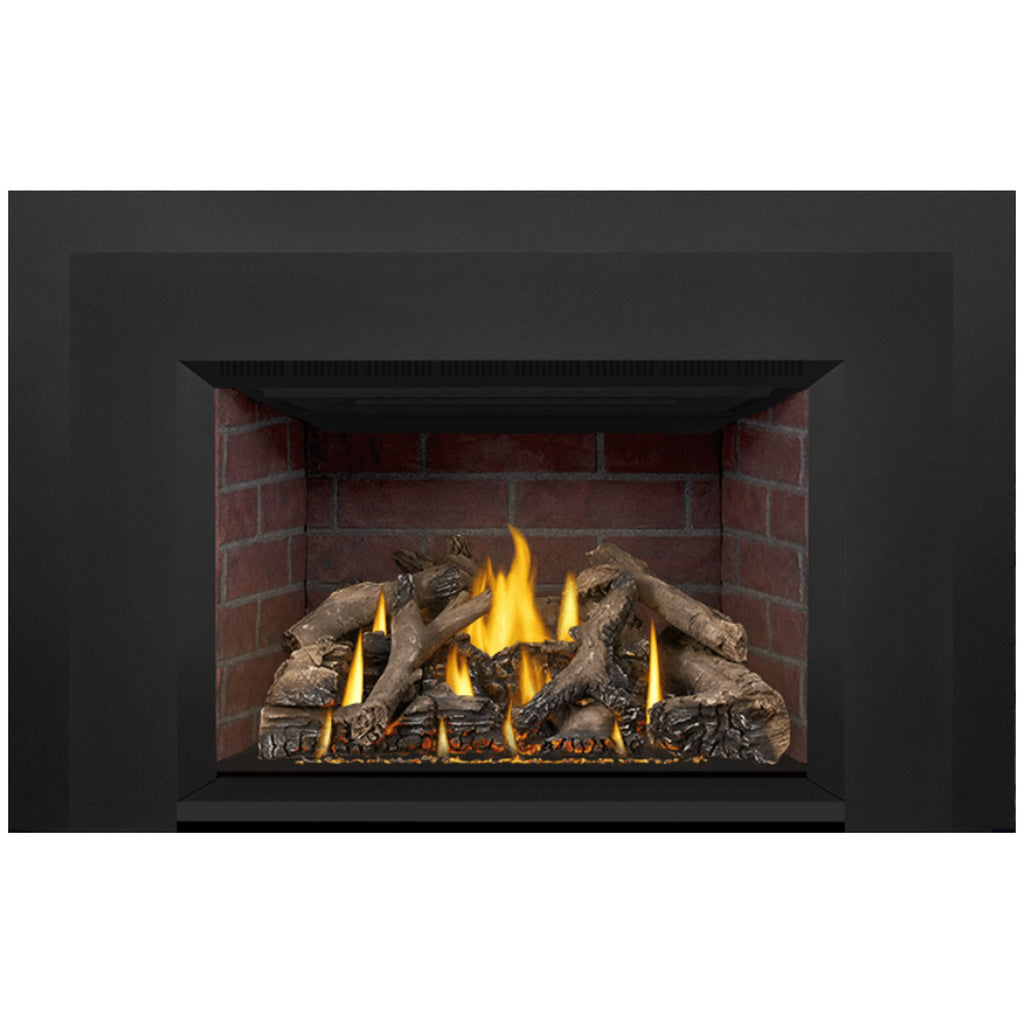 Direct vent gas fireplace insert, flames and log set visible in dark frame over brick
