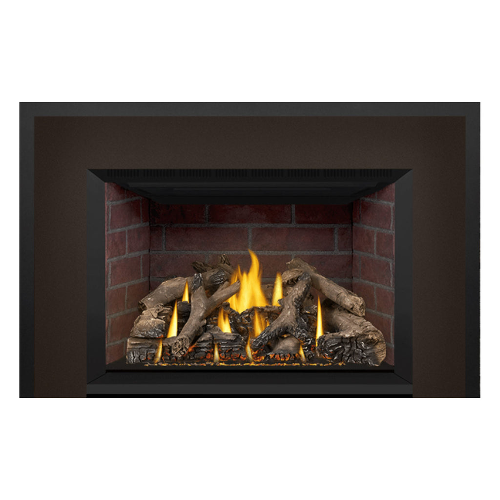 Direct vent gas fireplace insert with burning flames and decorative log set in brick