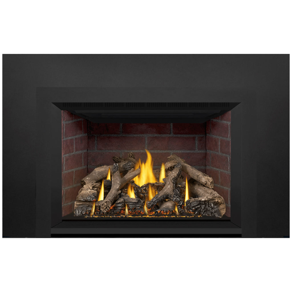 Gas fireplace insert firebox with glowing flames, logs, and brick lining