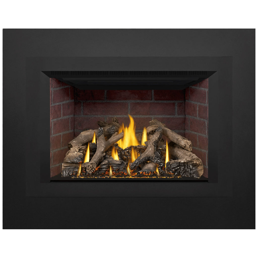 Direct-vent gas fireplace insert with firebox flames and charred-looking logs in red brick