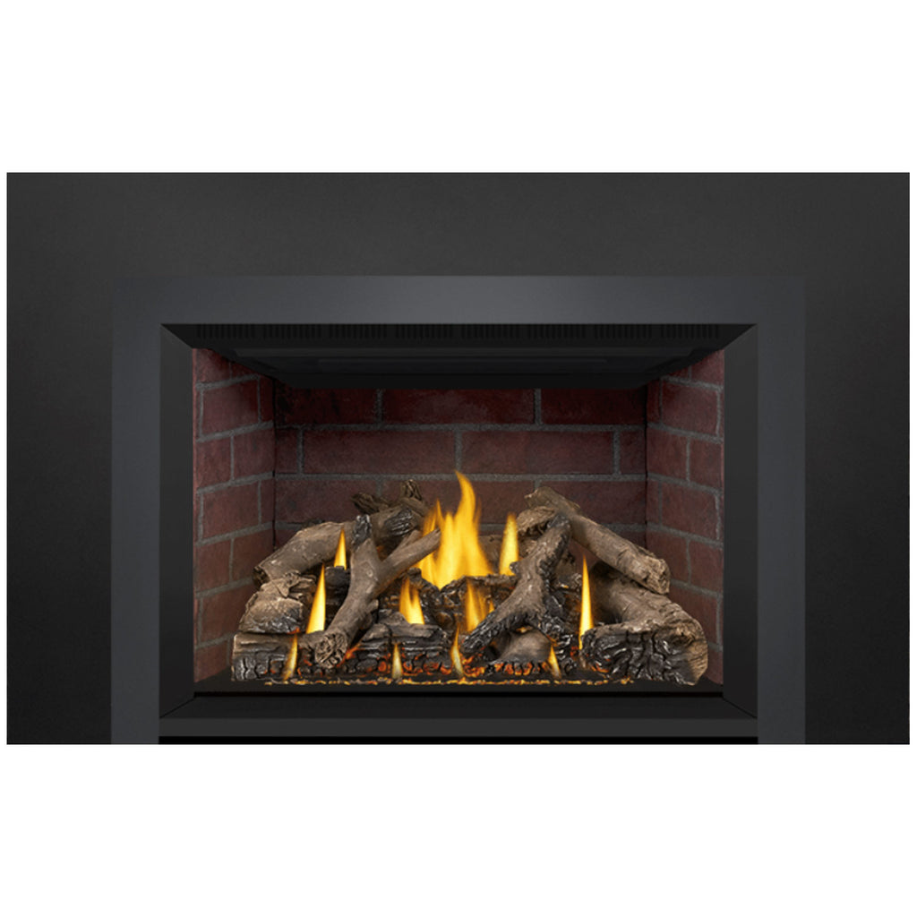 Direct vent gas fireplace insert with firebox flames and dark log and coal pieces