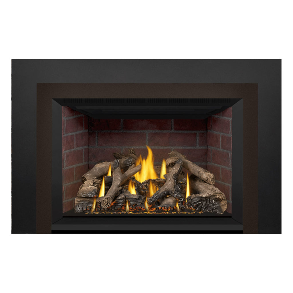 Direct vent gas fireplace insert with burning flames over dark logs and embers