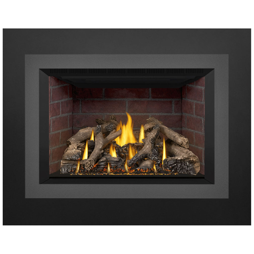 Direct-vent gas fireplace insert with glowing log bed and bright flames inside red brick