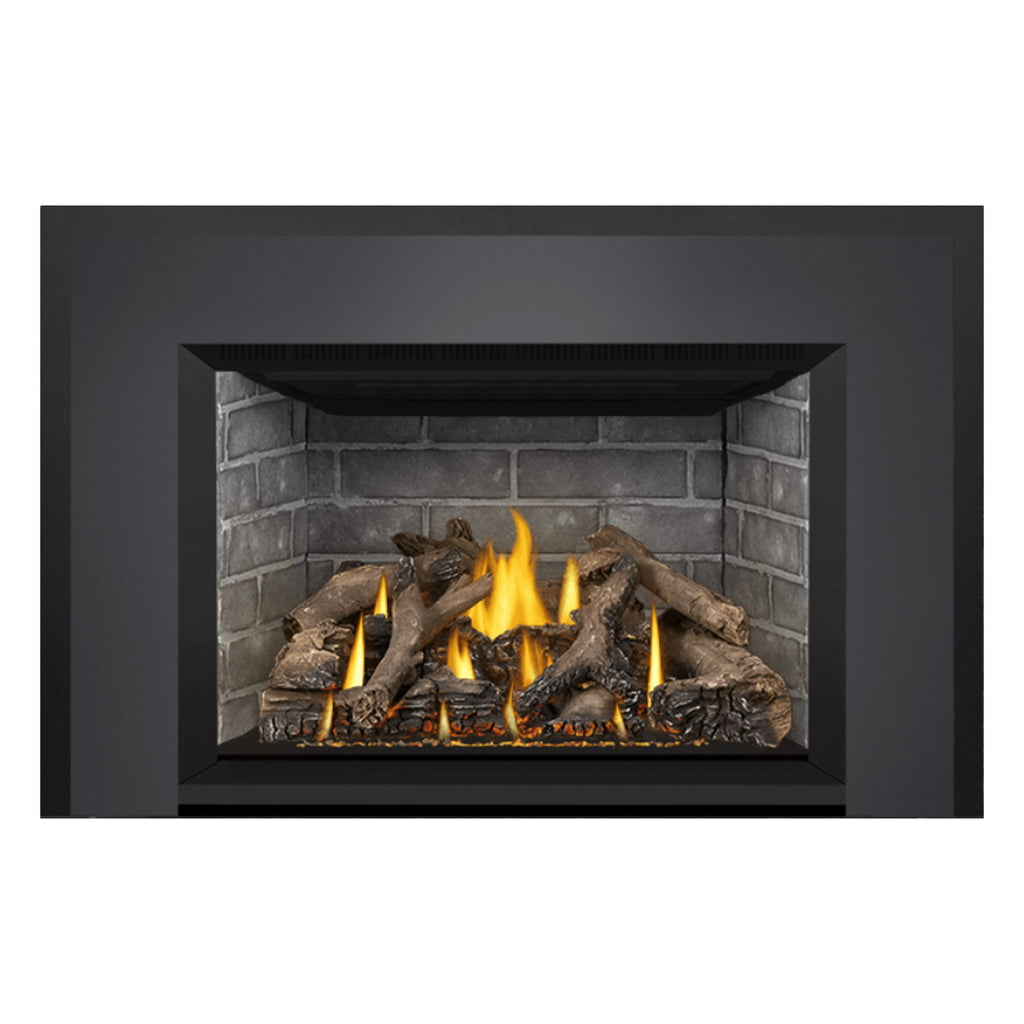Direct vent gas fireplace insert in dark surround with stone interior and yellow-orange flames