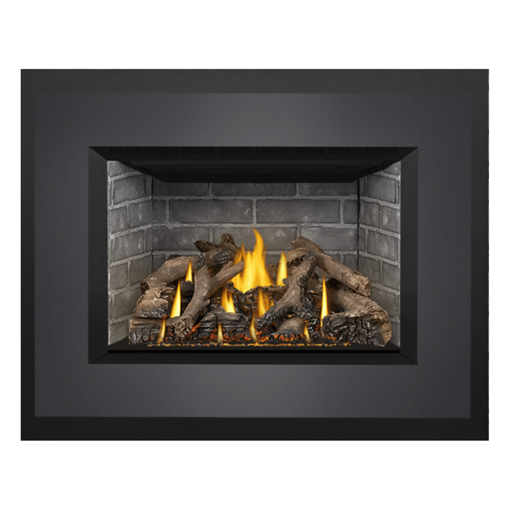 Direct vent gas fireplace insert with dark surround and stone-lined interior; flames over logs