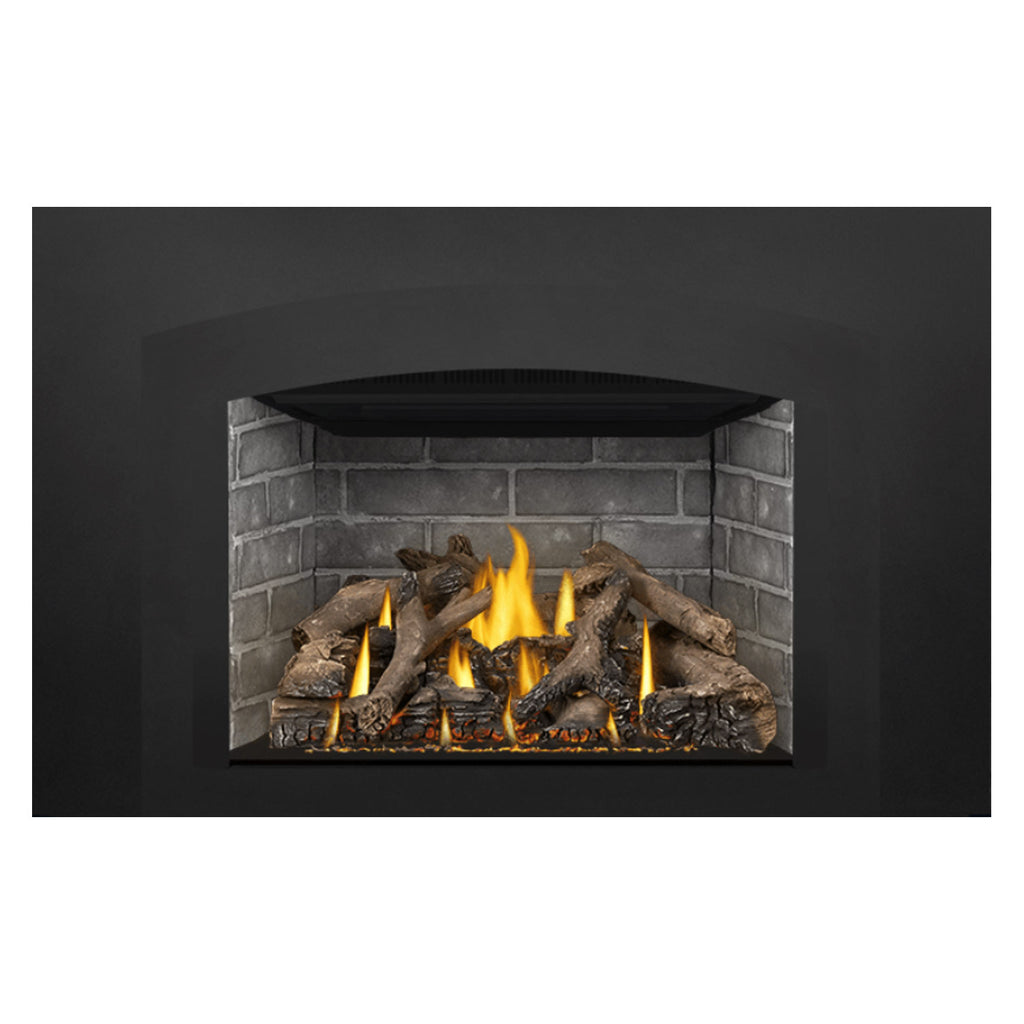 Gas fireplace insert with burning flames, gray stone surround, and dark log set