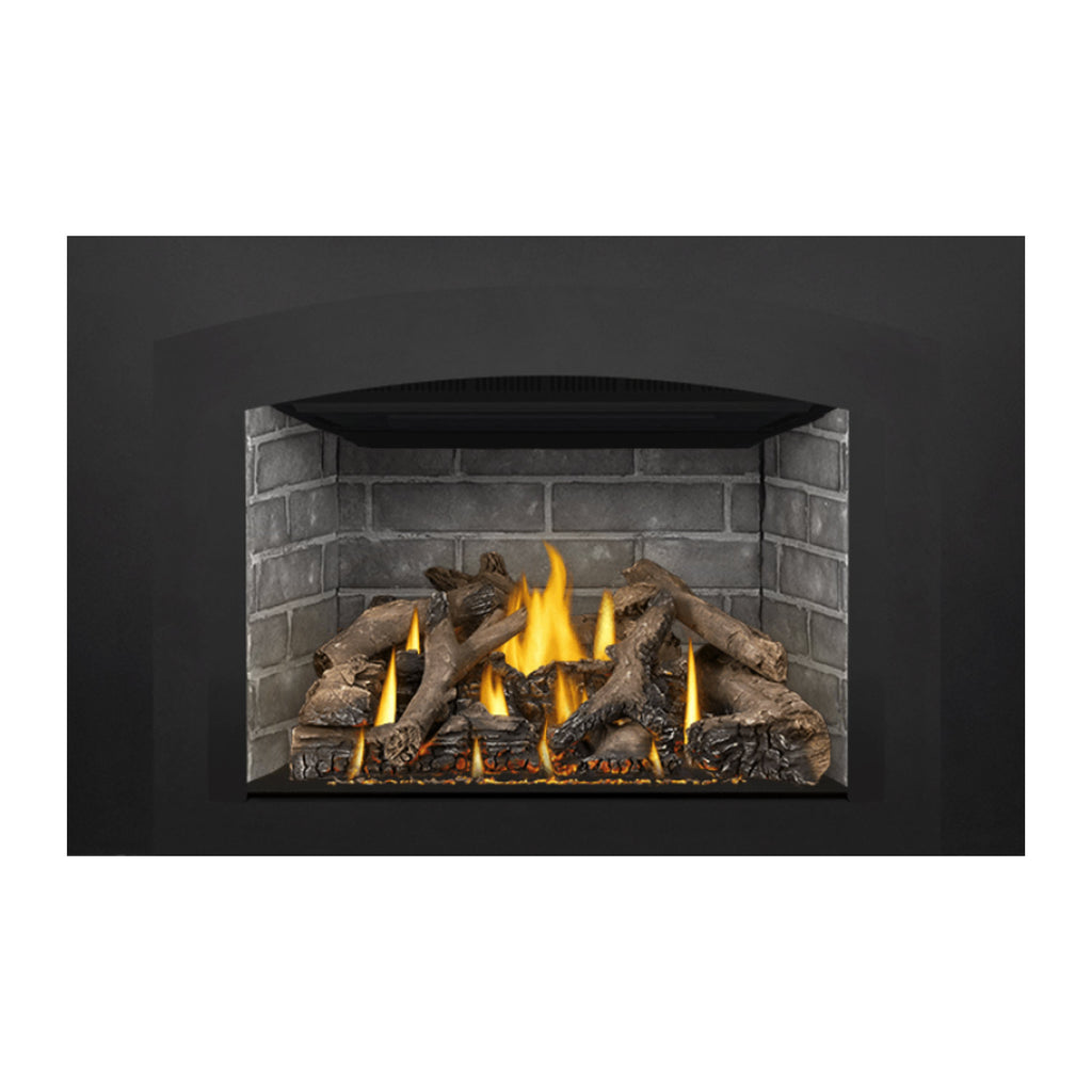 Gas fireplace insert showing brick interior, bright flames, and dark logs