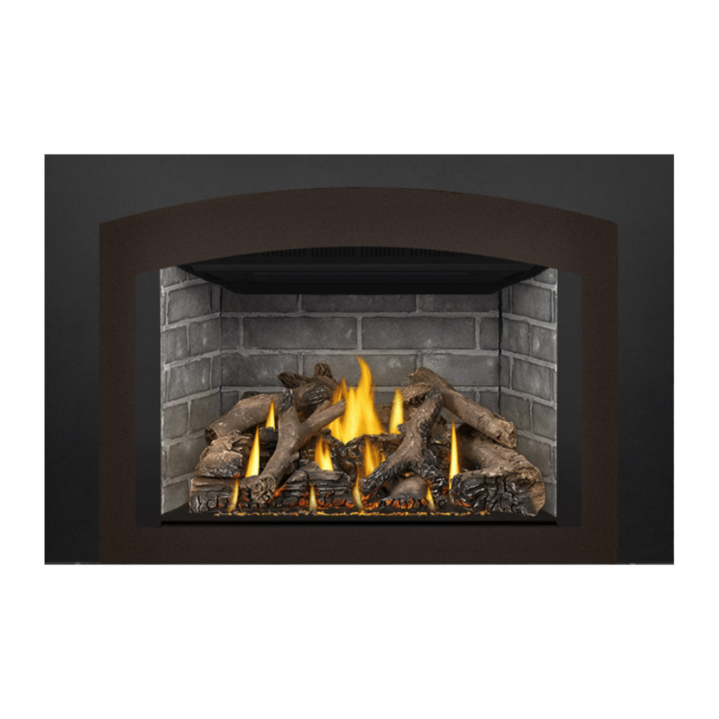 Gas fireplace insert showing burning flames in gray stone surround with dark logs