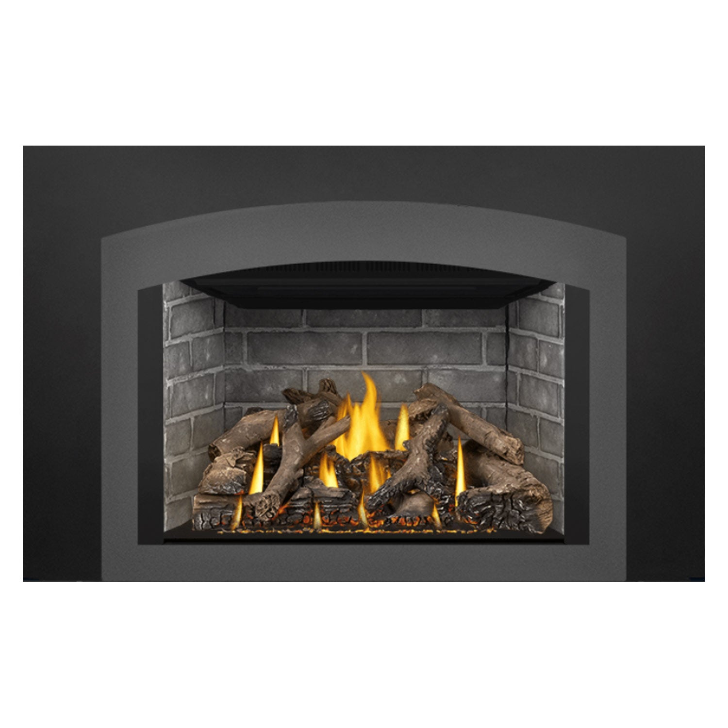 Gas fireplace insert with burning flames behind gray stone surround and dark logs