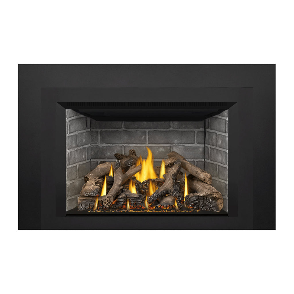 Direct vent gas fireplace insert with bright flames and logs in ember bed