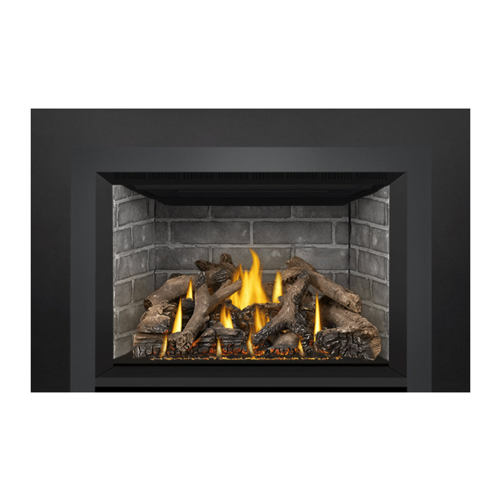 Direct vent gas fireplace insert showing flame center over dark log bed
