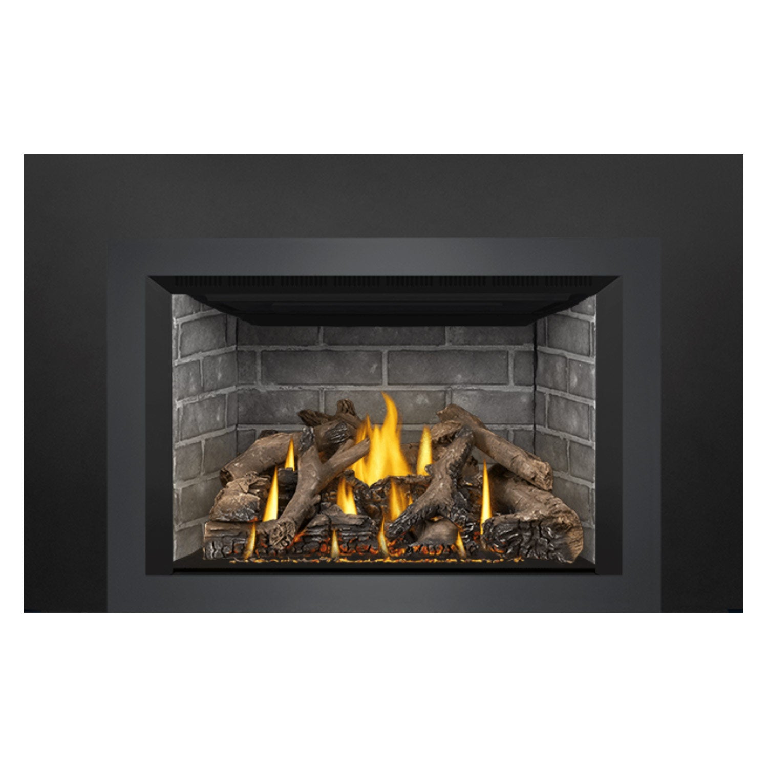 Gas fireplace insert view of brick interior with bright flames over dark logs