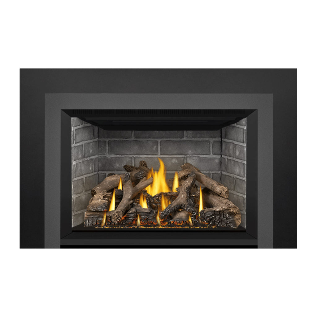 Direct vent gas fireplace insert with burning log and ember bed inside brick surround