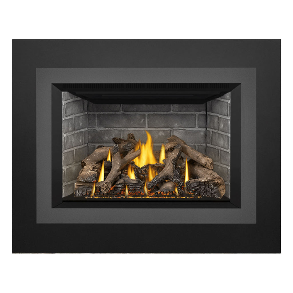 Gas fireplace insert front view with brick interior, flames, and dark firewood