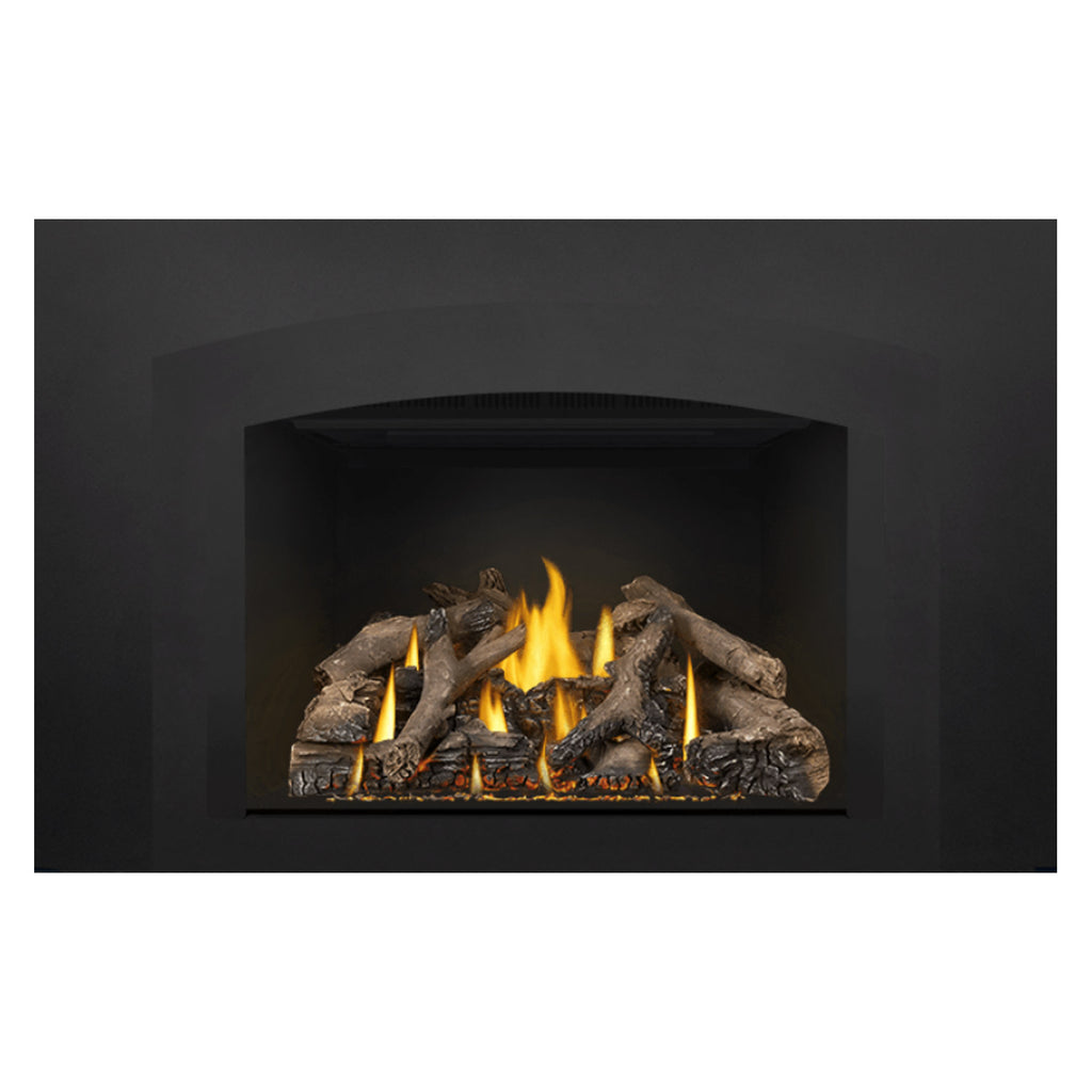 Gas fireplace insert showing burning logs and yellow flames within a black recessed firebox