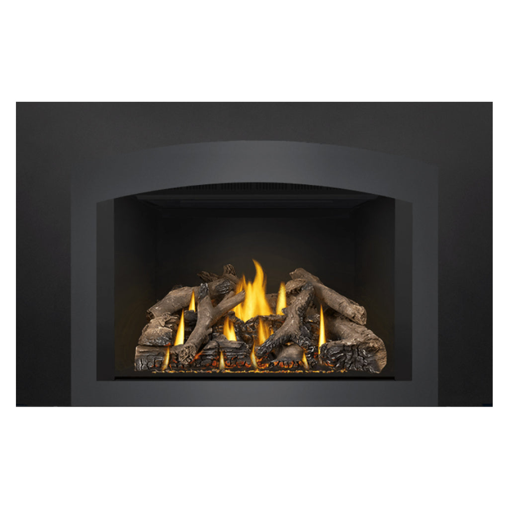 Gas fireplace insert with burning logs and bright yellow flames in a recessed black chamber
