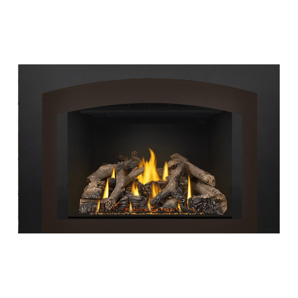 Gas fireplace insert with a black hood and burning logs, glowing yellow flames in the firebox