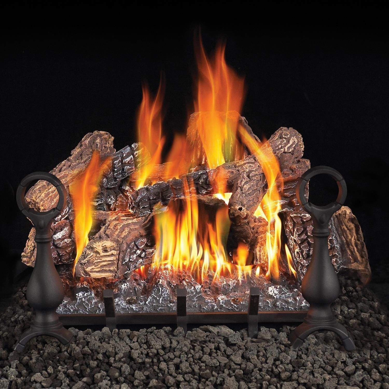 Vented gas log set with glowing flames, faux logs, and black burner bases
