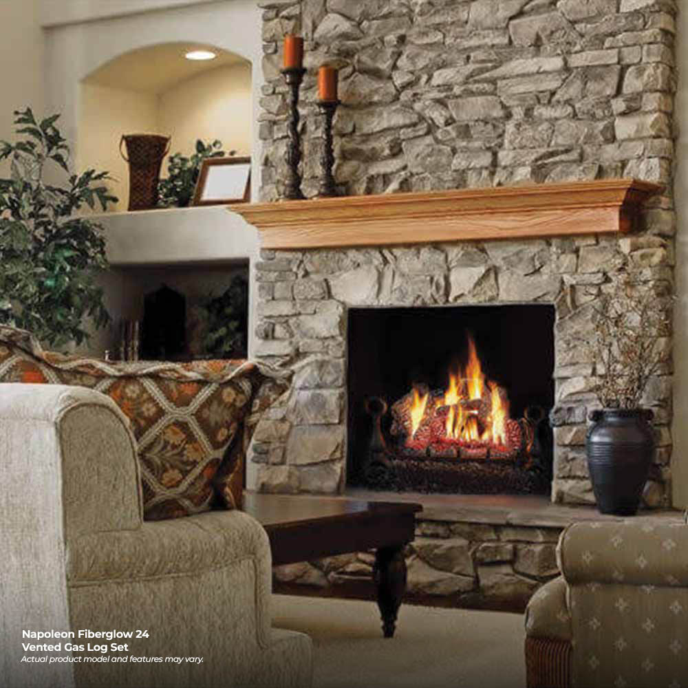 Vented gas fireplace log set with burning logs in a stone fireplace opening