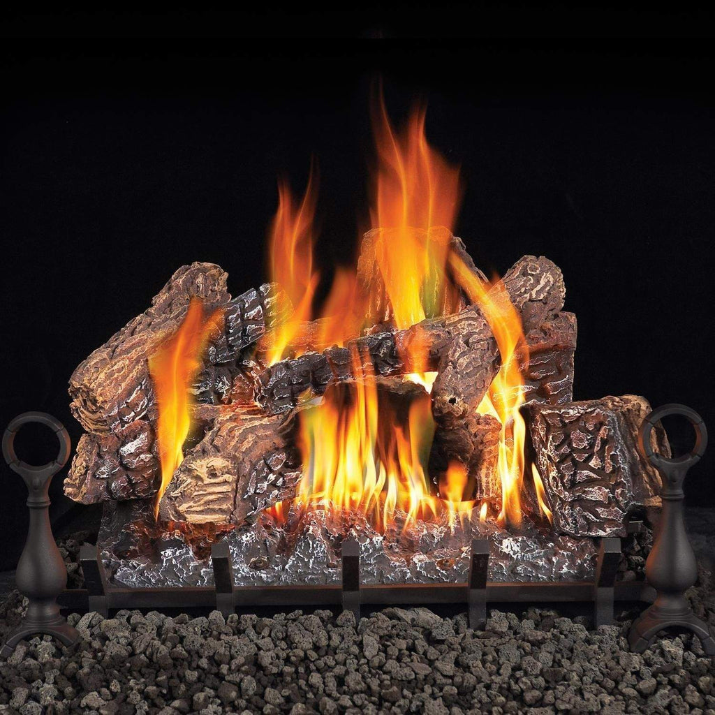 Vented gas log set burning flames with metal grate and dark logs