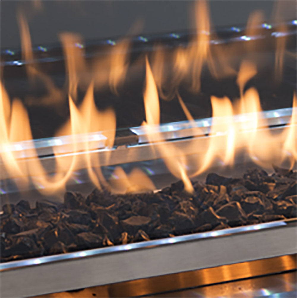 Onyx black crushed glass media in a metal fire pit tray with flames