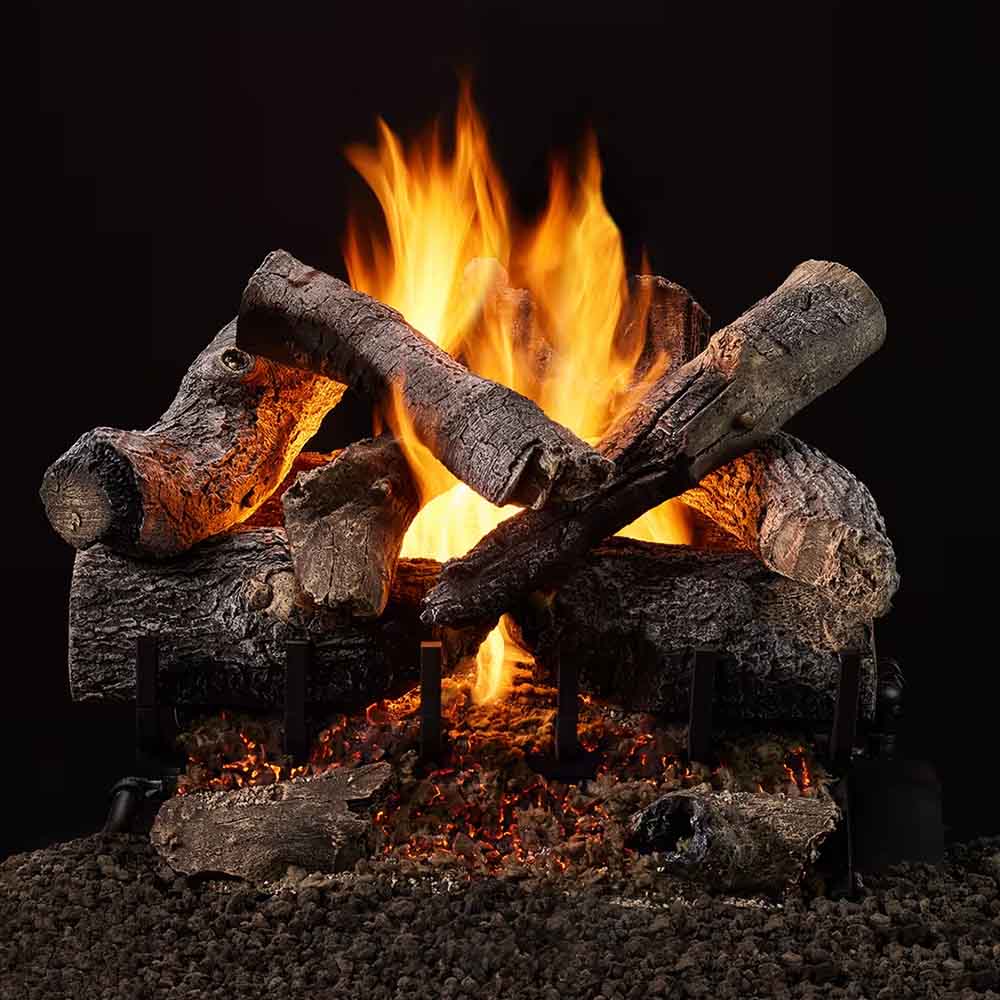 Vented gas log set with burning oak-style logs and glowing ember bed in a firebox