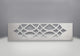Ornamental chrome trivet with geometric lattice cutout, rectangular plate