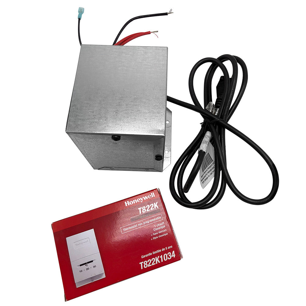 Heating and cooling thermostat controller with metal housing and black wiring, plus red manual