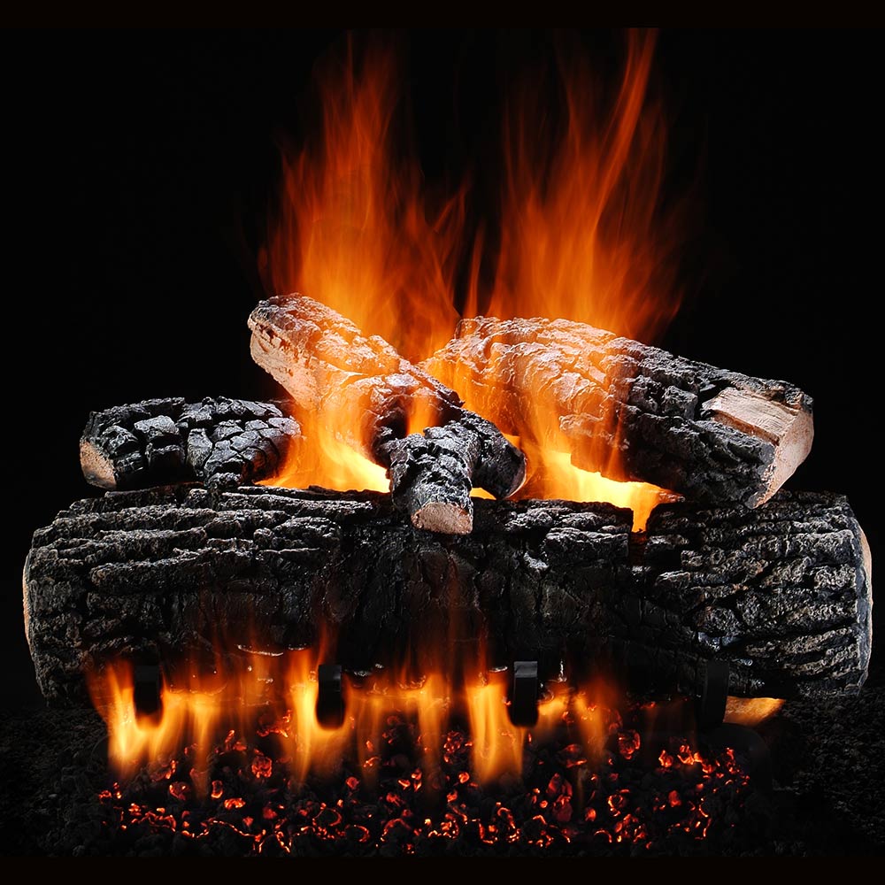 Vented gas log set with glowing embers and burning flames, black charred logs