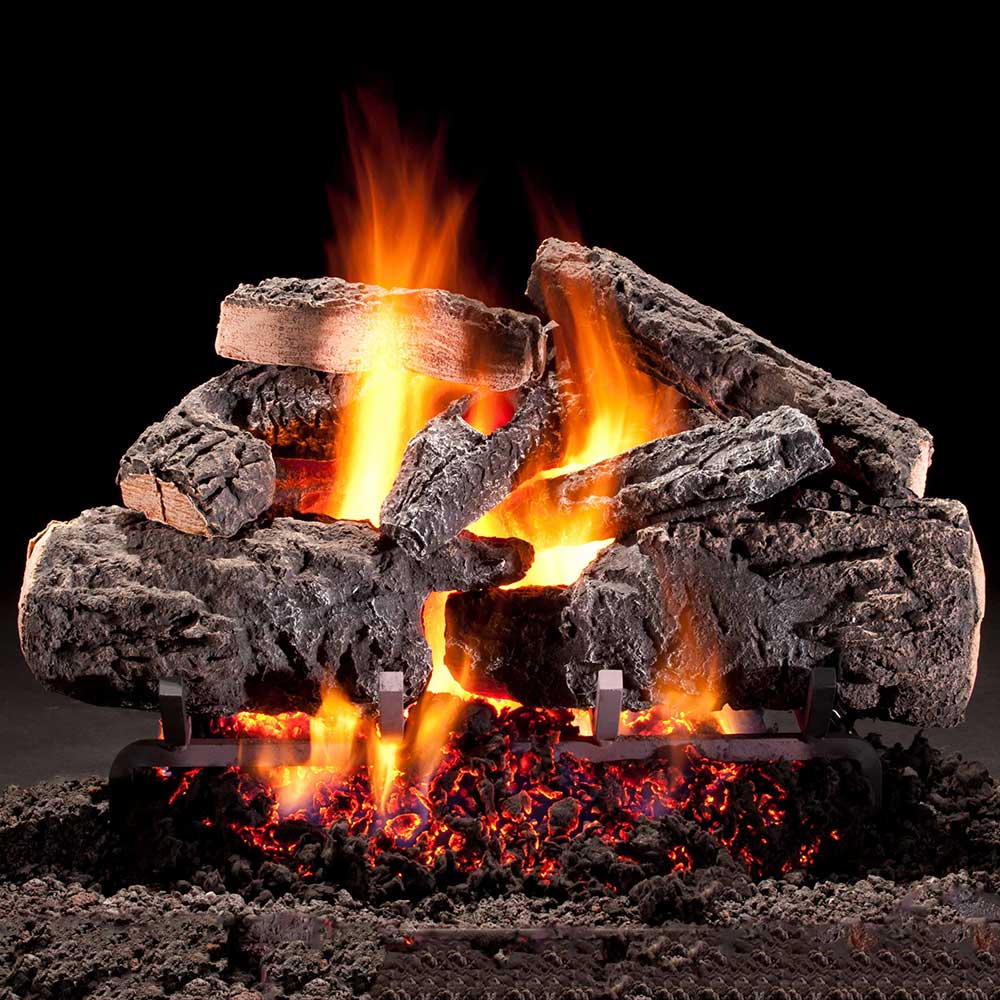 Gas log set with vented burner flames over dark logs and glowing embers
