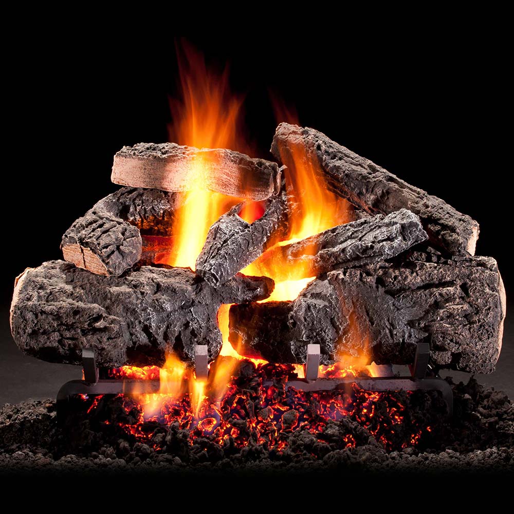Vented gas log set with glowing flames and dark charred log pieces