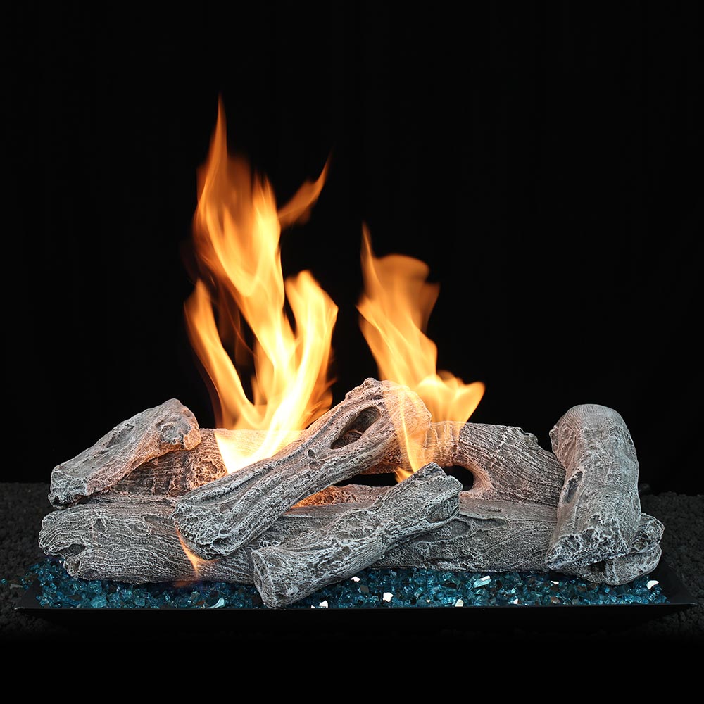 Vented gas log set with driftwood-style logs and open flames