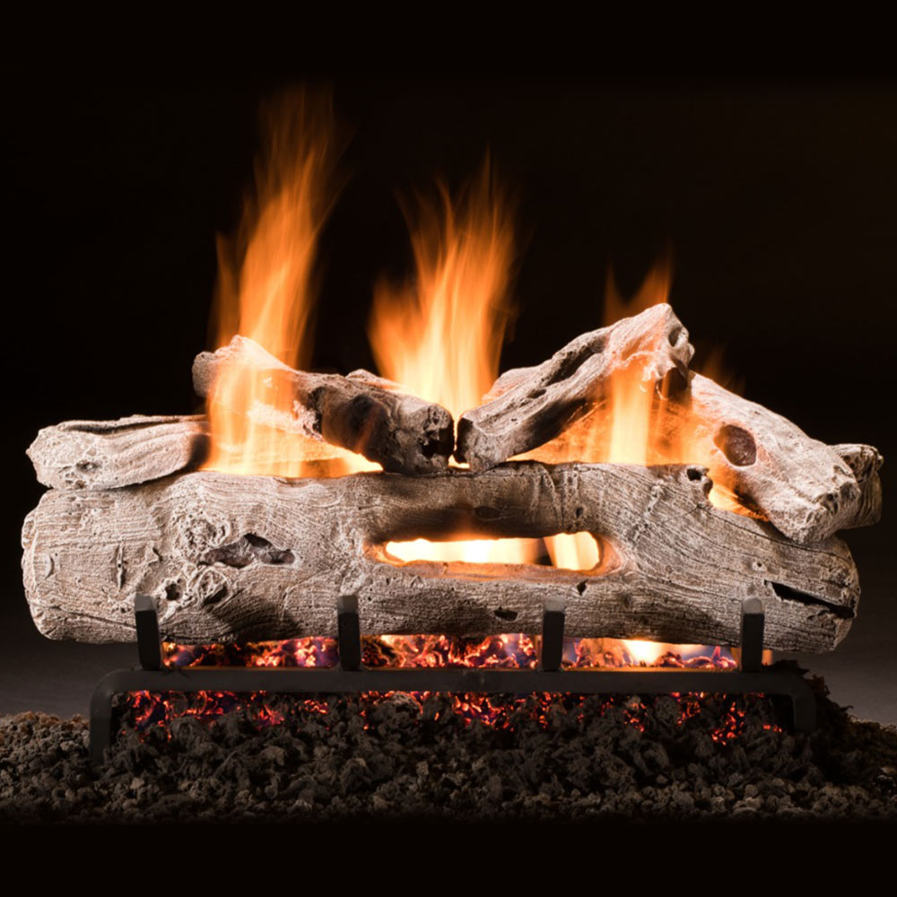 Driftwood-style vented gas logs with glowing flames and ember bed