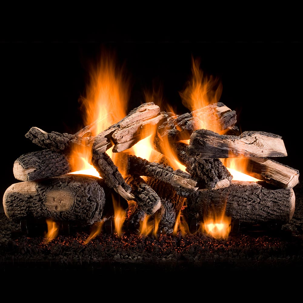 Gas log set with stacked wood-look logs and bright orange flames