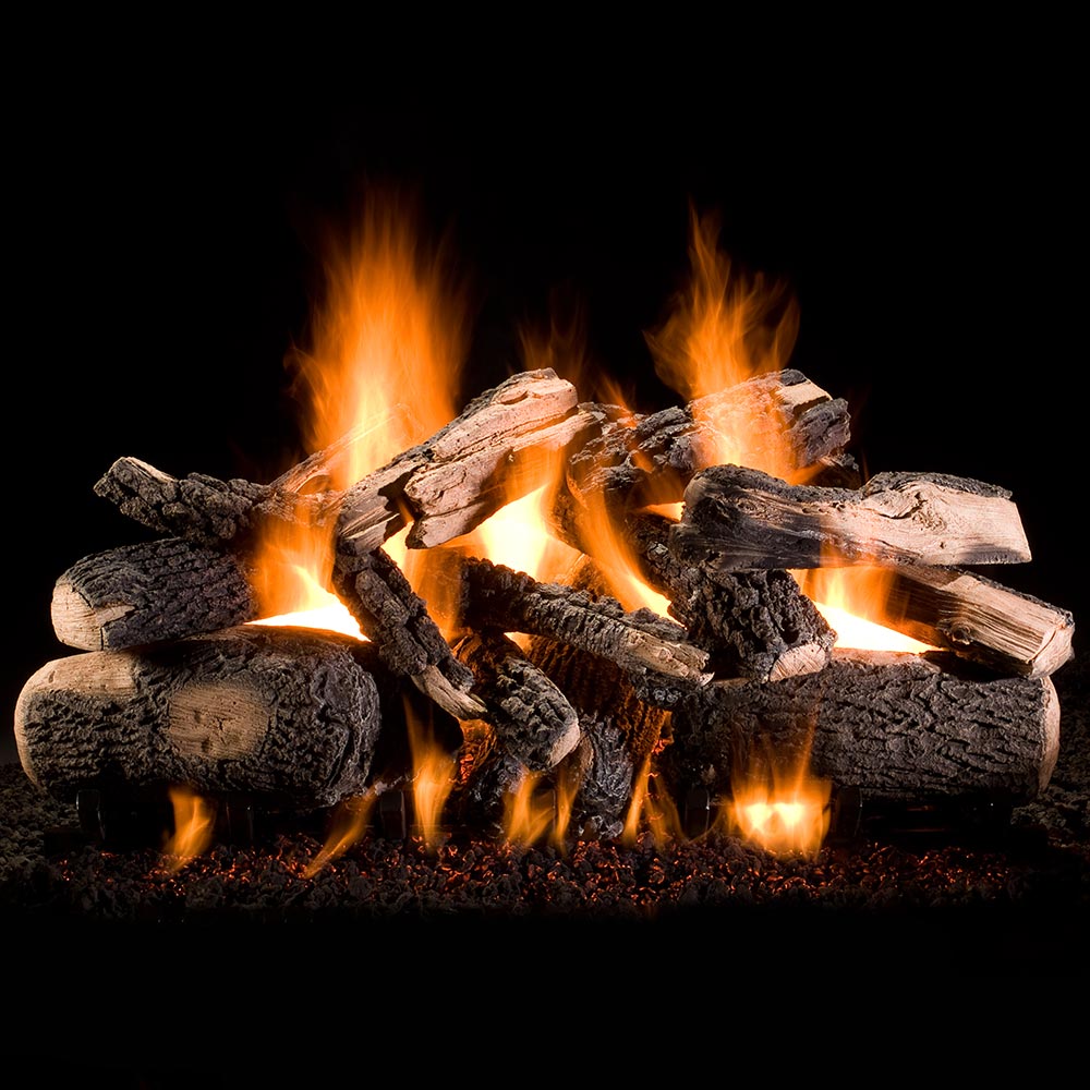 Vented gas log set with stacked logs and bright orange flames