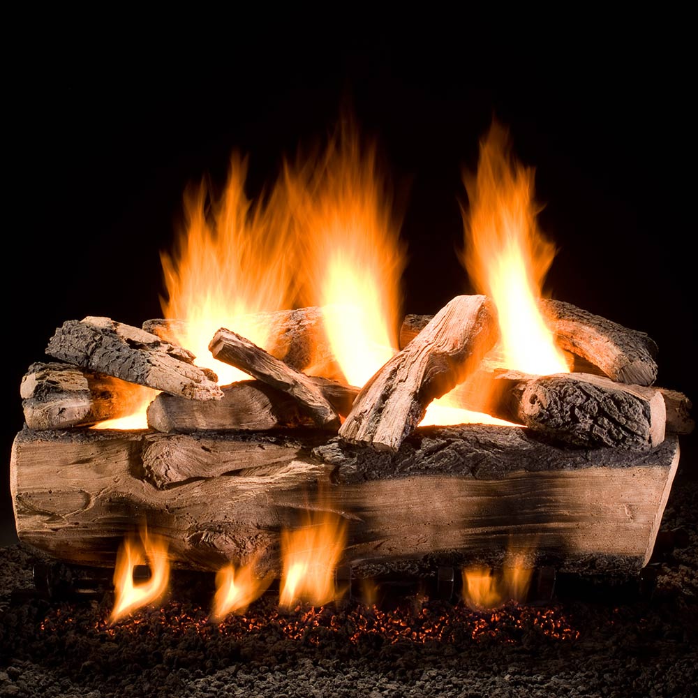 Gas log set with split logs and bright orange flames in a firebox tray