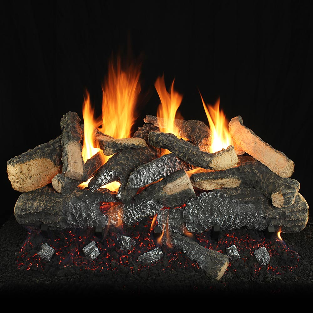 Vented gas log set with dark split logs and glowing flames