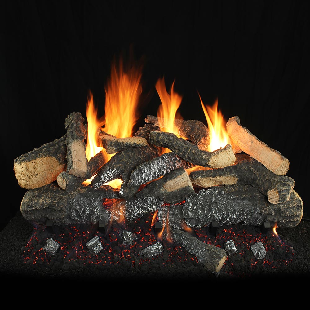 Vented gas log set with stacked logs and bright flames over dark firebed