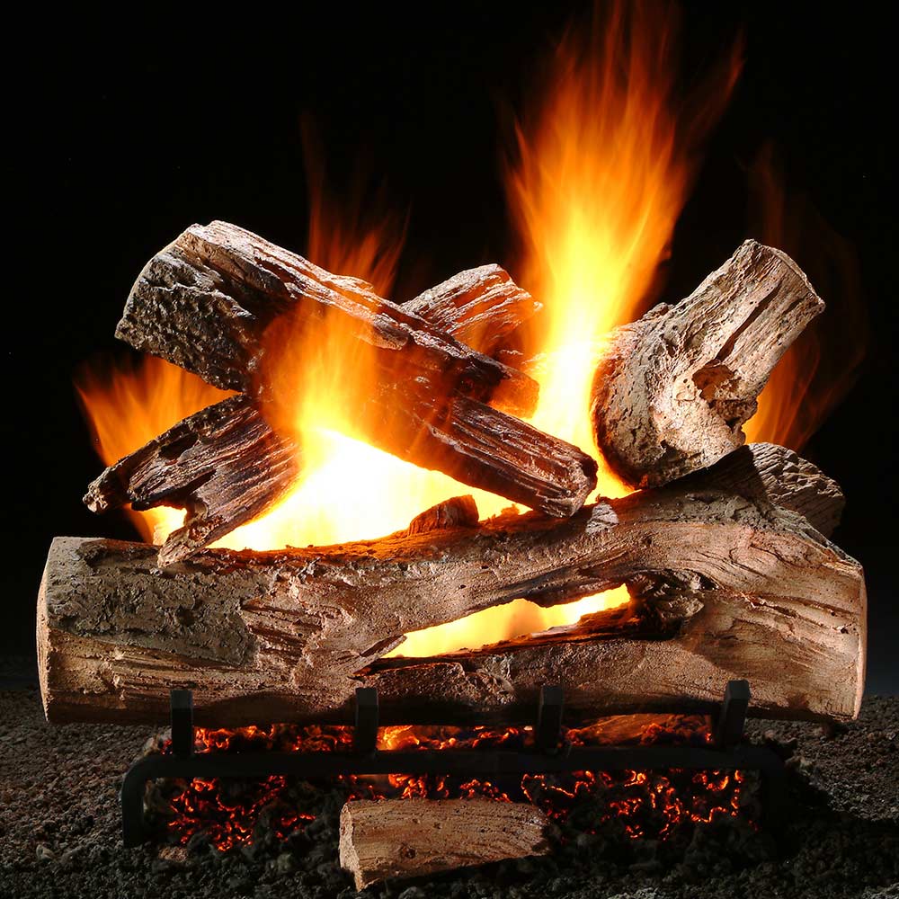Gas log set with stacked split logs and bright flames in a log bed