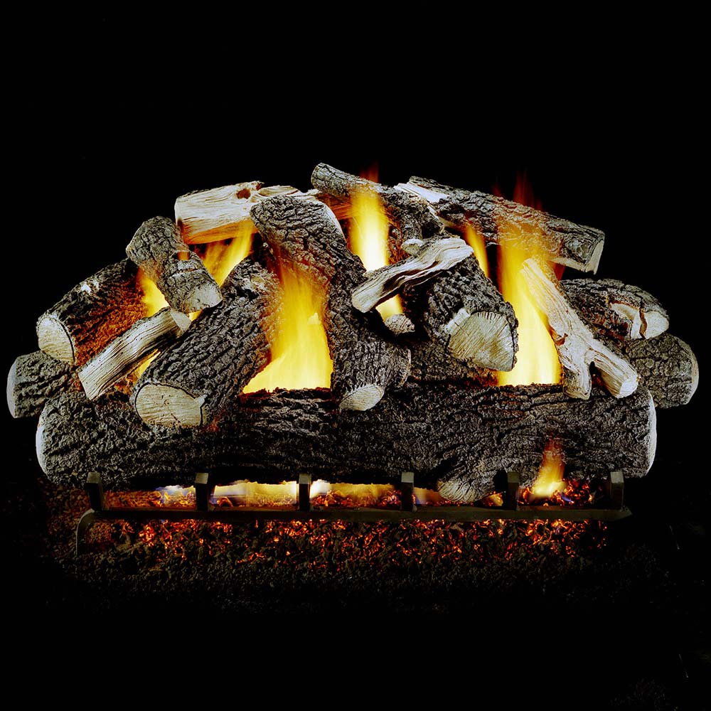 Vented gas log set with stacked dark logs and bright yellow flames